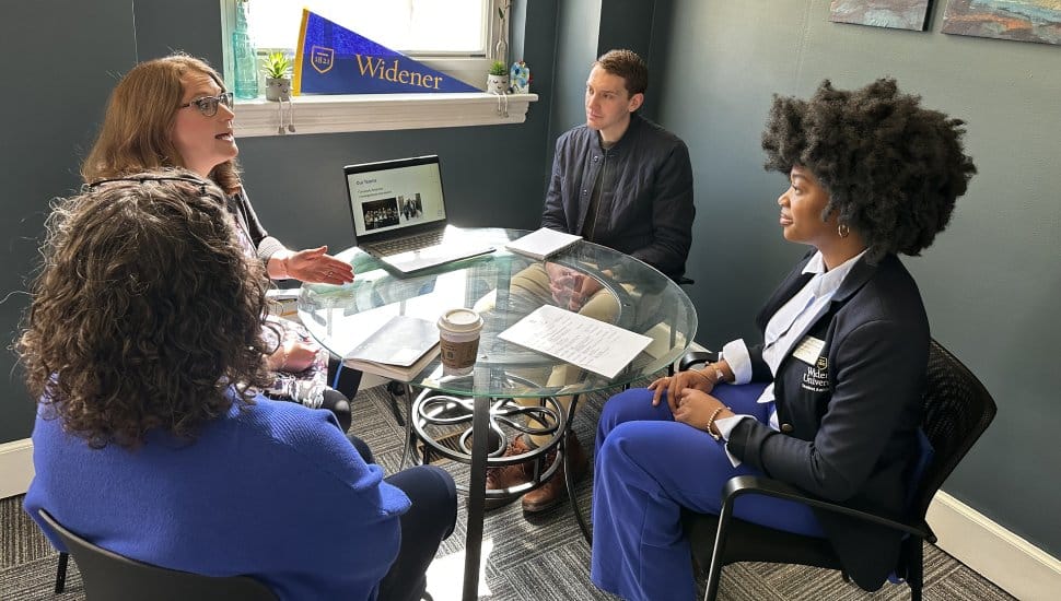 Letitia Dondo, in her role as Widener president for a day, takes in a meeting.