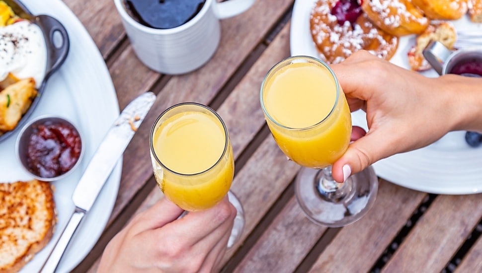 A toast with mimosas.