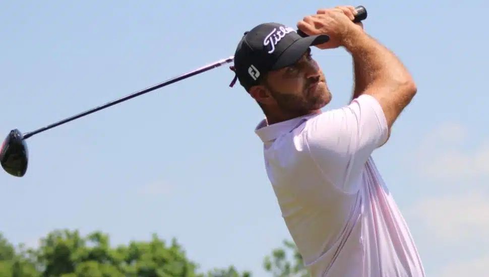 Branden Shattuck in mid-golf swing.