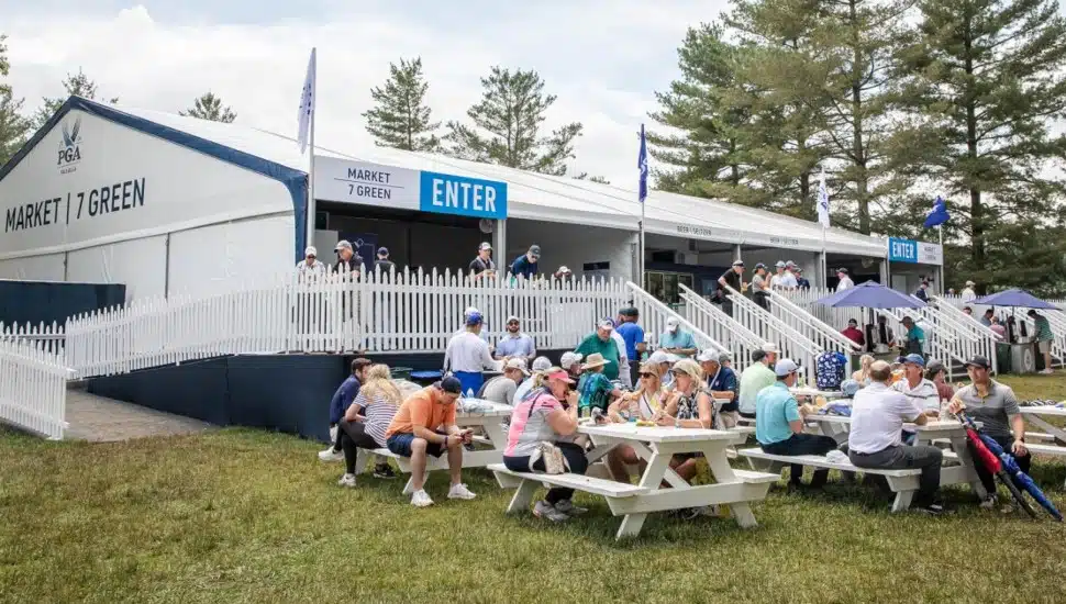 Food stand at the 2026 PGA Championship with attendants eating outside.