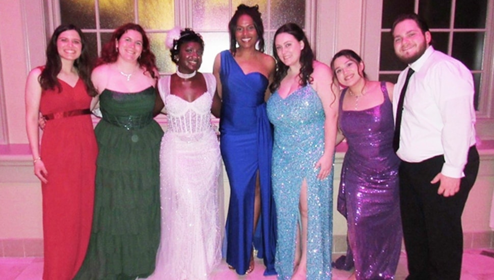 College students pose for group photo at gala.