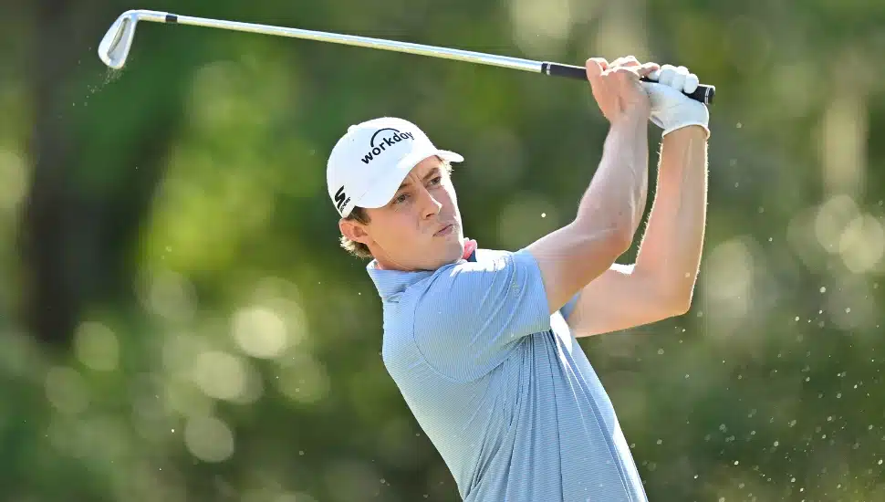 Matt Fitzpatrick mid golf swing.