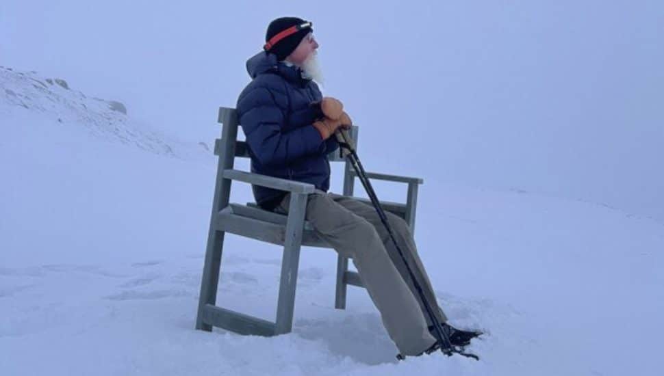 Pat Croce sitting in a chair on Everest.