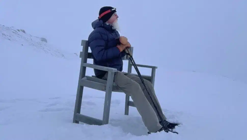 Pat Croce sitting in a chair on Everest.