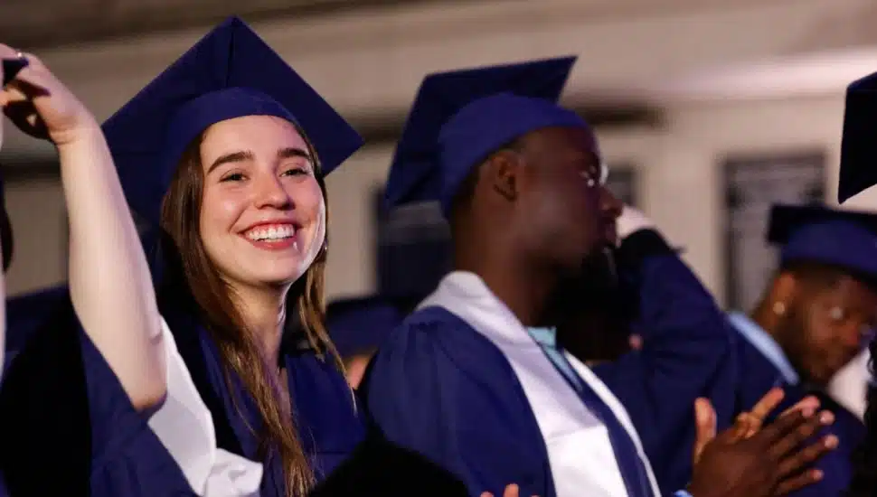 A Penn State Brandywine graduate celebrates her accomplishment at the 2026 commencement ceremony.