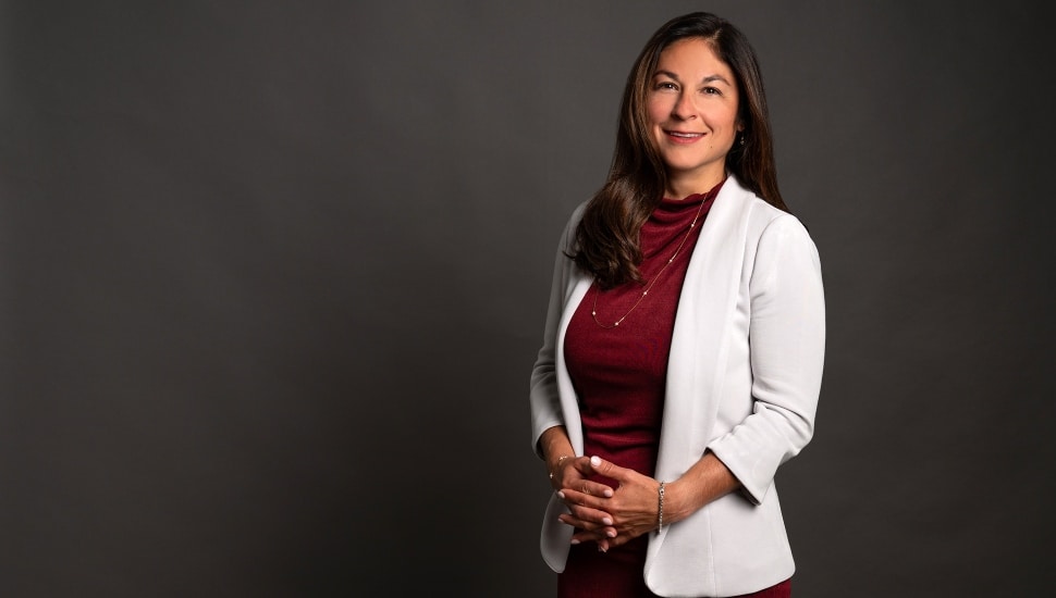 Female executive in white jacket.