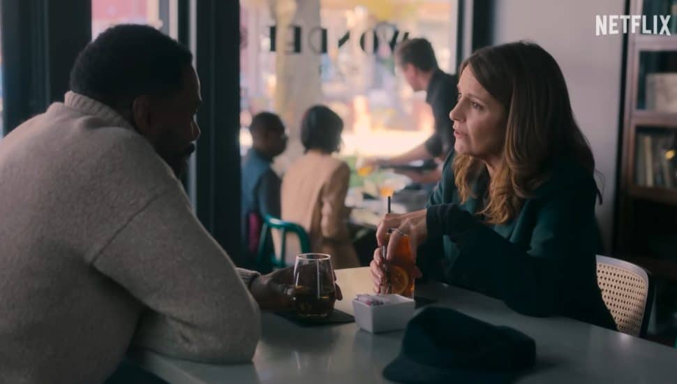 Tina Fey and Colman Domingo's characters talking in a cafe in season one of The Four Seasons.