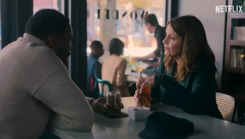 Tina Fey and Colman Domingo's characters talking in a cafe in season one of The Four Seasons.