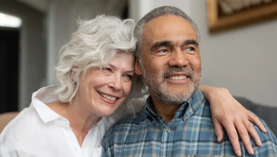 A senior couple is all smiles.