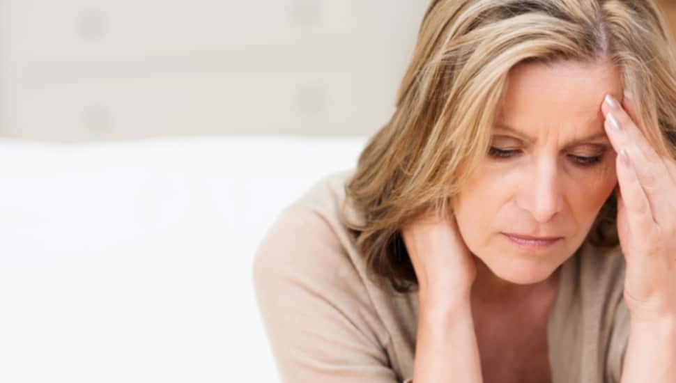 A woman looks sad and worried.